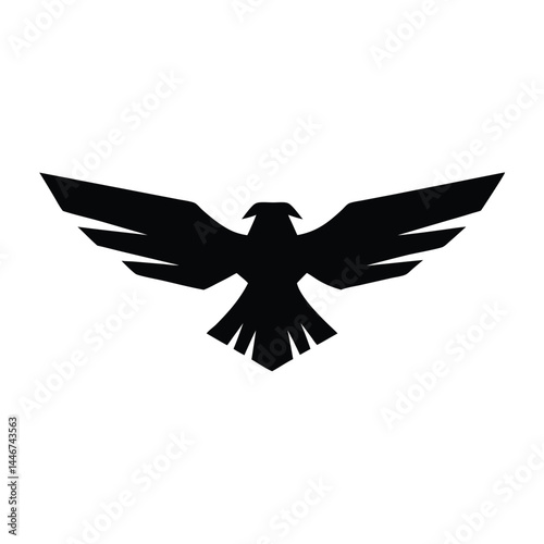 Silhouette of an eagle flying with spread wings on a white background