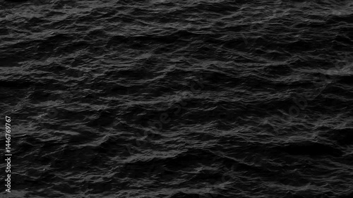 A mesmerizing black and white depiction of sea waves in motion, emphasizing the fluidity and strength of the ocean’s currents, with a dramatic contrast that highlights nature’s raw beauty.
