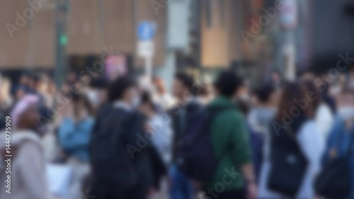 Wallpaper Mural Blurred defocused view of a bustling crowd of people in the famous Shibuya Crossing in Japan during the daytime, densely packed and moving quickly through the streets.  Torontodigital.ca
