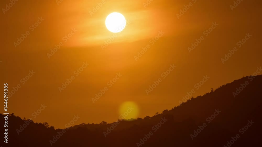 Timelapse of dramatic sunset with orange sky in a cloudy day. Timelapse of dramatic sunset with orange sky in a cloudy day.
