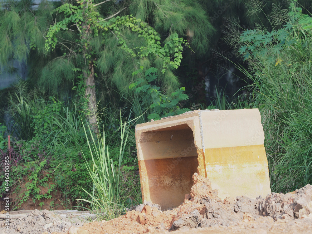 Naklejka premium Construction of precast reinforced concrete drainage pipes