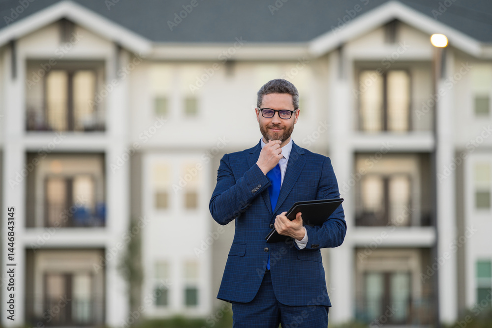 Real estate agent business man in suit hold holder clipboards outside. Hispanic Businessman. Business Man broker or real estate agent. Business man in suit outdoor. Real estate business man.