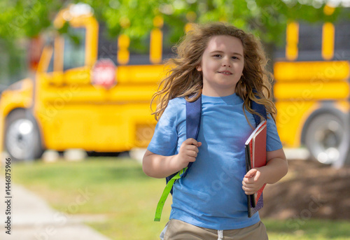 Back to school. School day starts for young student. Kid student with backpack near school bus. Kid go to school. Child going to class. Schoolchild.