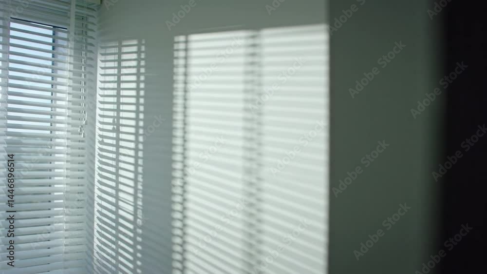 Sunlight Streaming Through Window Blinds Creating Shadows Inside Home Sunlight Streaming Through Window Blinds Creating Shadows Inside Home