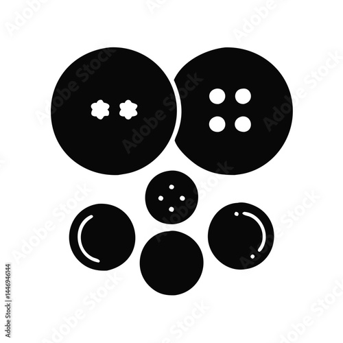 Arrangement of Black Buttons with Various Hole Patterns on a White Background