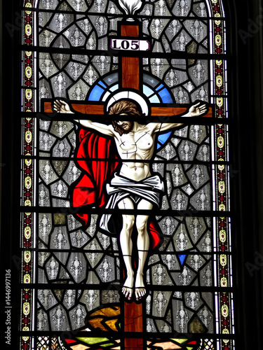2024-10-16, Auxerre, FRANCE. Stained glass (17th century) of Jesus Christ crucified on the cross.
