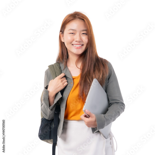 Young Asian female student smiling confidently while holding laptop and backpack, representing education, university lifestyle, modern learning, technology , back to school ,transparent background
