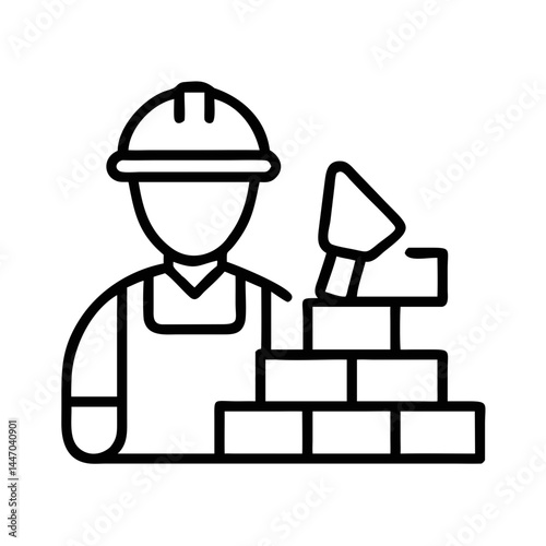 Bricklayer with trowel building a wall against a plain background  