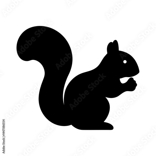 Silhouette of a Squirrel with Large Bushy Tail Eating Something Delicate