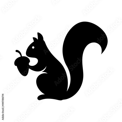 Black silhouette of a squirrel holding an acorn against a white background