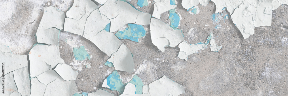 Peeling paint on the wall. Old concrete wall with cracked flaking paint. Weathered rough painted surface with patterns of cracks and peeling. High resolution texture for background and design. Closeup