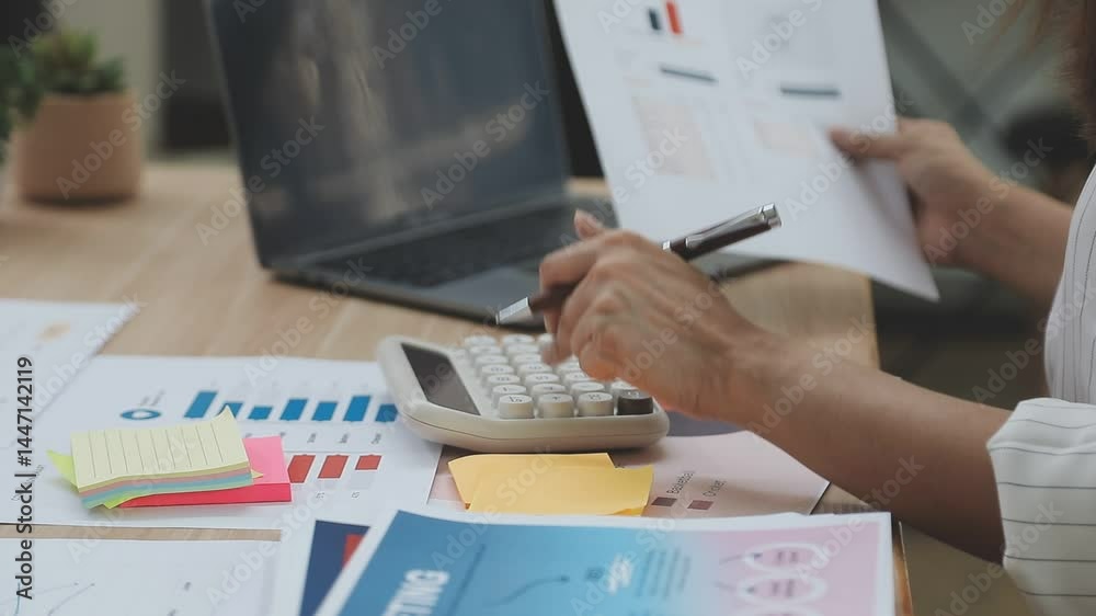 Accounting company provide finance and taxation planning for profitable cash flow, Auditor and accountant team working in office, analyze financial data and accounting record with calculator.Insight