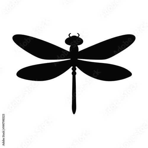 Silhouette of a dragonfly with its wings spread wide on a white background