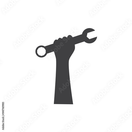 Hand holding a wrench