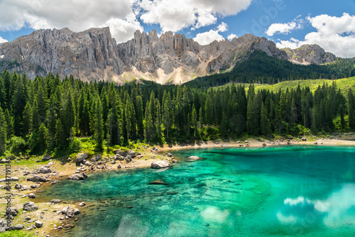 Lake Carezza, an alpine lake under the Latemar mountain range in the Dolomites Itay
