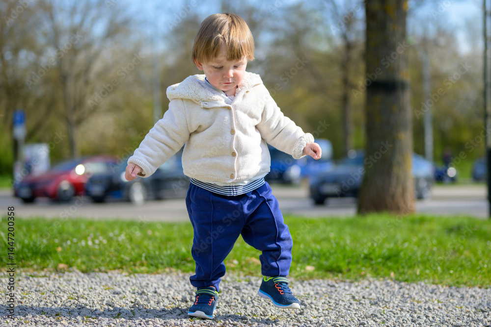 Fototapeta premium Toddler Exploring Outdoors Alone