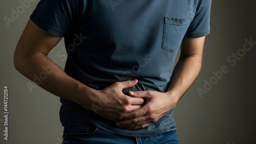 Person Holding Stomach in Pain or Discomfort
