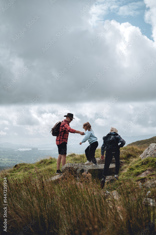 Teamwork helping hand trust assistance. Dad helping daughter to climb. Teamwork helping hand trust assistance. Dad helping daughter to climb.