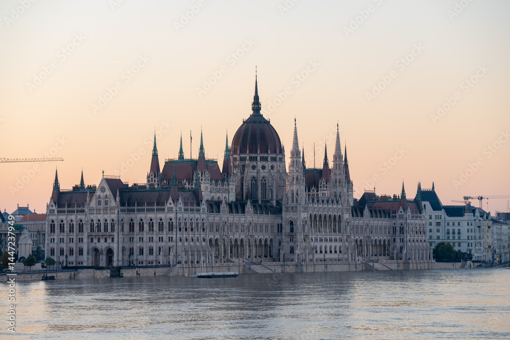 Fototapeta premium Budapest, Hungary - September 22, 2024: Parliament Against the Flood – Budapest’s iconic landmark reflected in the swollen Danube