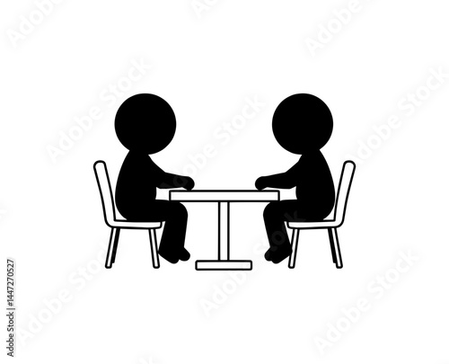 two black figures are sitting at the table opposite each other