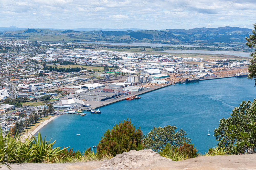Fototapeta premium Wide view from top of Mount over Tauranga harbour and port