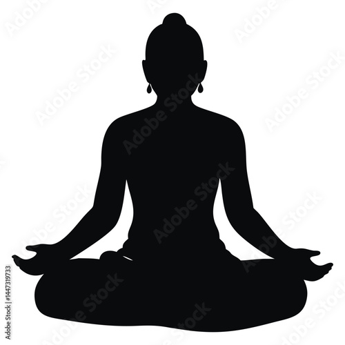 Silhouette of a person in a meditation pose, sitting in lotus position