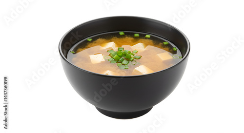 Bowl of miso soup with tofu and green onions.  A savory broth, comforting and healthy
