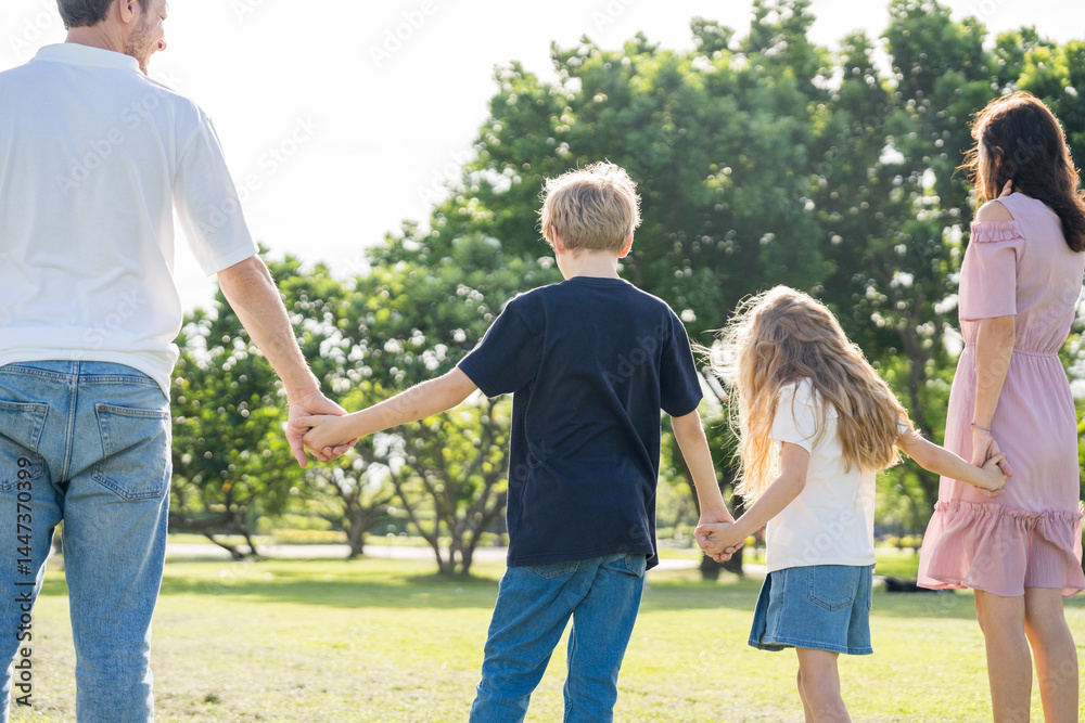 Fototapeta premium Happy family parent children having picnic outdoor activity. Enjoy happiness moment summer playing together including father mother son and daughter relaxing in the morning sunrise.