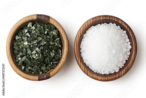 Wooden bowls of sea salt and seaweed flakes