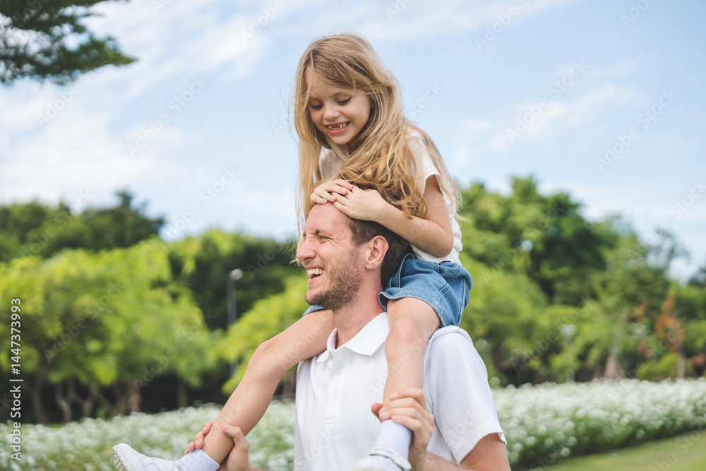 Fototapeta premium Happy family parent children having picnic outdoor activity. Enjoy happiness moment summer playing together including father mother son and daughter relaxing in the morning sunrise.