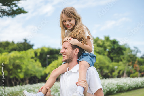 Happy family parent children having picnic outdoor activity. Enjoy happiness moment summer playing together including father mother son and daughter relaxing in the morning sunrise.