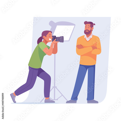 A skilled photographer is focused on capturing their subject beautifully in a studio setting