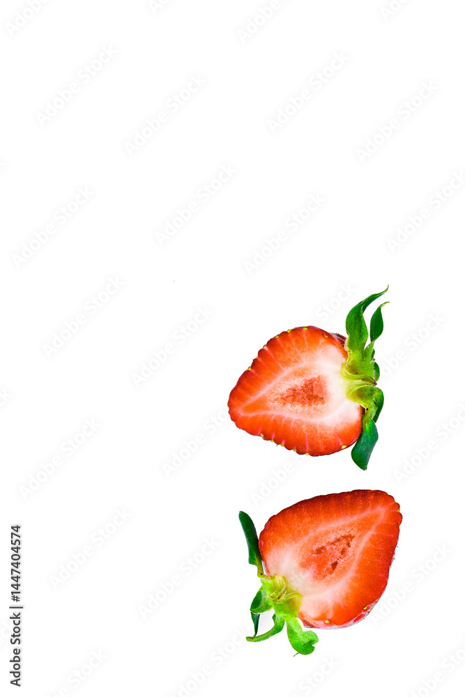 Fresh ripe strawberries cut in half isolated on a white background. Fresh ripe strawberries cut in half isolated on a white background.
