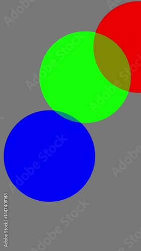 Wallpaper Mural Three colored circles (Red, Green, Blue) move on a neutral gray vertical screen. Their intersection produces Cyan, Magenta, and Yellow hues, generating a soft yet dynamic visual composition. Torontodigital.ca