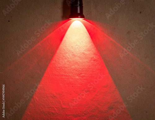  Glowing red spotlight on paper background 