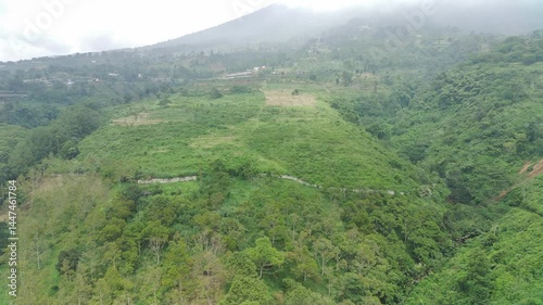 Aerial View of Lush Green Mountainside in Indonesia