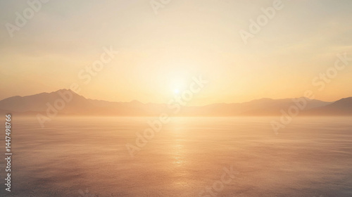 Serene sunset over calm water with distant mountains
