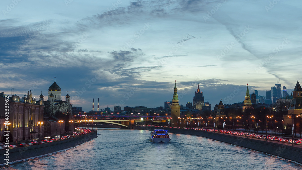 Naklejka premium Ensemble of Moscow Kremlin and Moskva-City business center view across Moskva river at a winter day to night timelapse hyperlapse