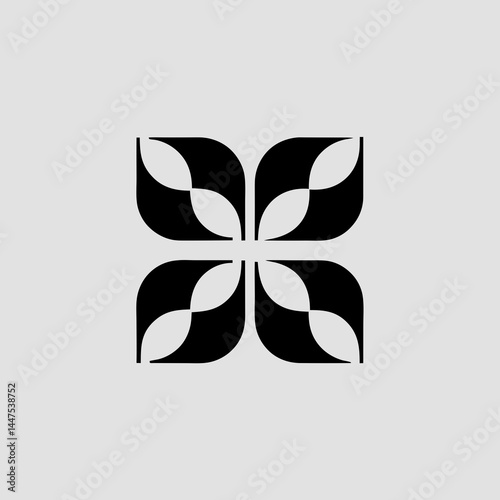 Abstract design of four black floral shapes arranged in a square pattern on a light gray background.