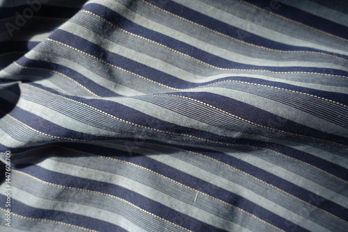 Obraz na płótnie blue and grey striped cotton fabric in soft folds w salonie