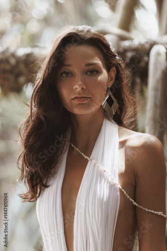 Obraz na płótnie Fashion portrait of serene woman in elegant white swimsuit with pearl accessory and soft lighting - concept for natural beauty, glowing skin, fashion promo, spa, and summer lifestyle visuals. w salonie