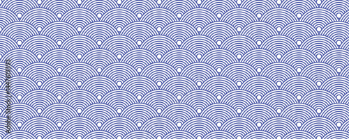 Seamless Japanese wave pattern in blue and white, inspired by traditional Seigaiha design, perfect for textiles, backgrounds, and decorative projects
