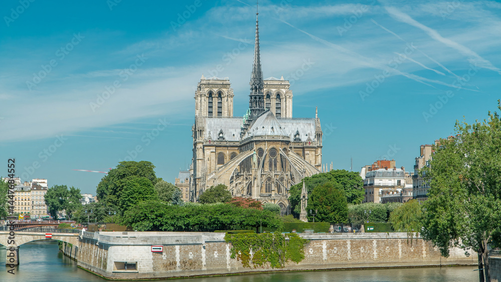 Naklejka premium Seine river and Notre Dame de Paris back side timelapse. Famous symbols of Paris