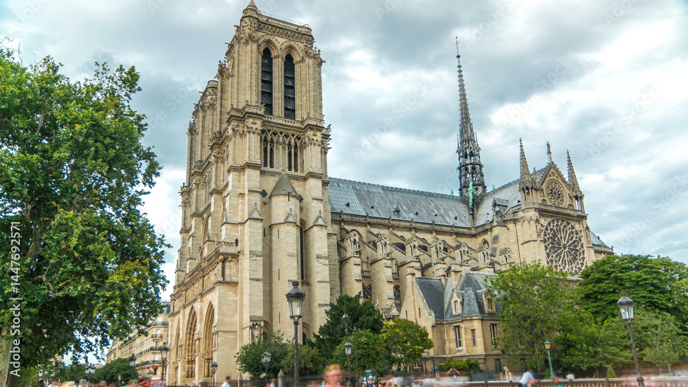 Obraz premium Notre-Dame de Paris timelapse, a medieval Catholic cathedral on the Cite Island in Paris, France