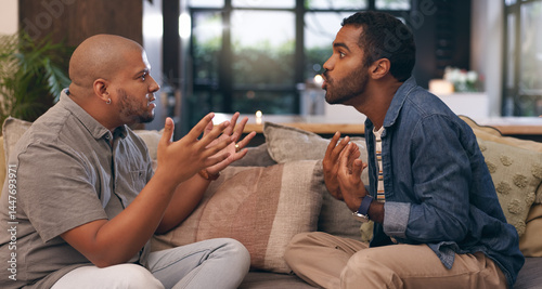 Konstfotografi Men, gay couple and argument on sofa at house with discussion, disagreement and relationship conflict
