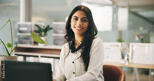 Portrait, laptop and business woman in office as insurance agent, risk advisor and claims specialist. Smile, professional and confident employee on computer with policy broker or coverage consultant