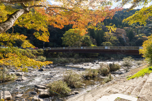Kaorukaede bridge across Tomoe river at Korankei gorge during autumn season