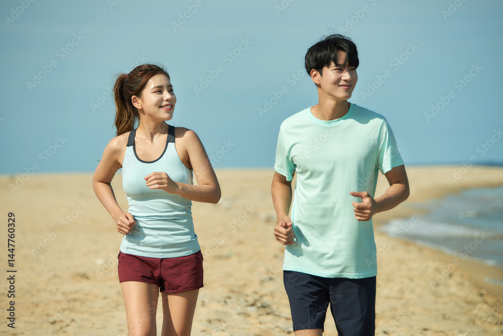 Young Couple Running on the Beach Young Couple Running on the Beach