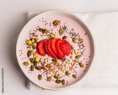 Healthy Breakfast Bowl with Strawberries, Chia Seeds, and Nuts on White Background