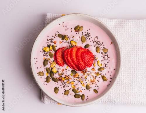 Strawberry Yogurt Bowl Topped with Seeds, Nuts, and Fresh Strawberries
